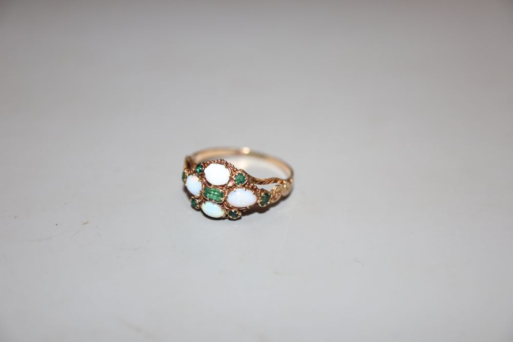 A Victorian yellow metal, white opal and emerald set cluster ring, size N/O, gross 25 grams.